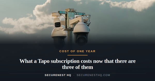Two modern surveillance cameras mounted on a pole in an urban setting under a cloudy sky. Overlaid text reads “What a Tapo subscription costs now that there are three of them” — Secure Nest H